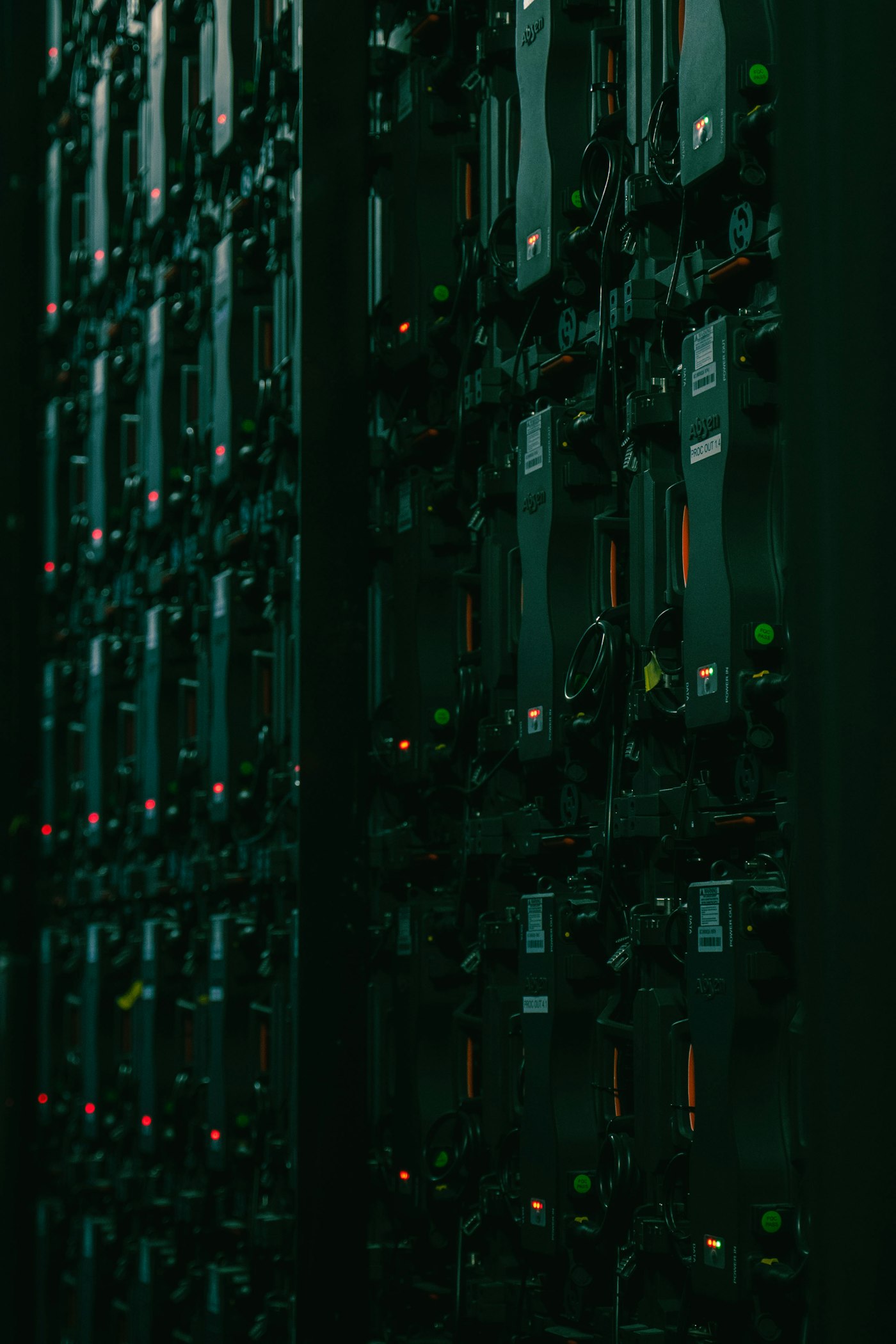 Rows of server racks in a dark data hall